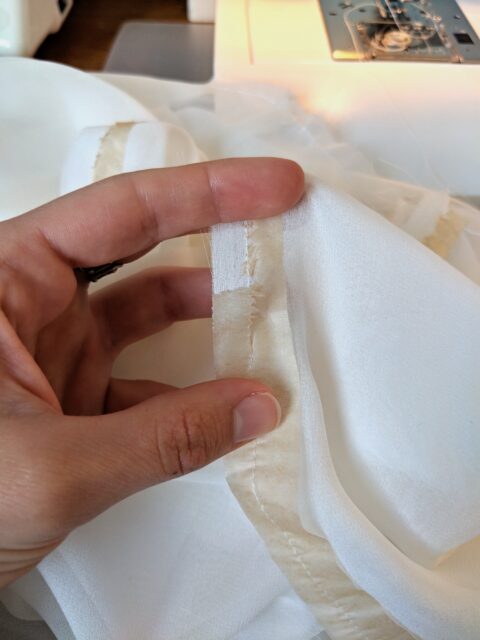 Removing the stabilising paper after sewing fine fabrics